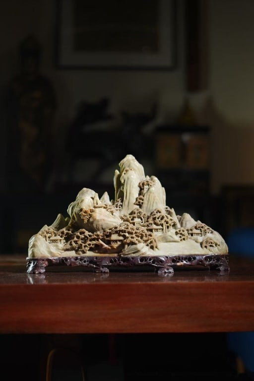 Chinese carved soapstone landscape mountain orname: Chinese carved soapstone landscape mountain ornament. Dimension: 41cm L x 8 x 24cm H. It is intricately sculpted from a single piece of multi-colored soapstone
