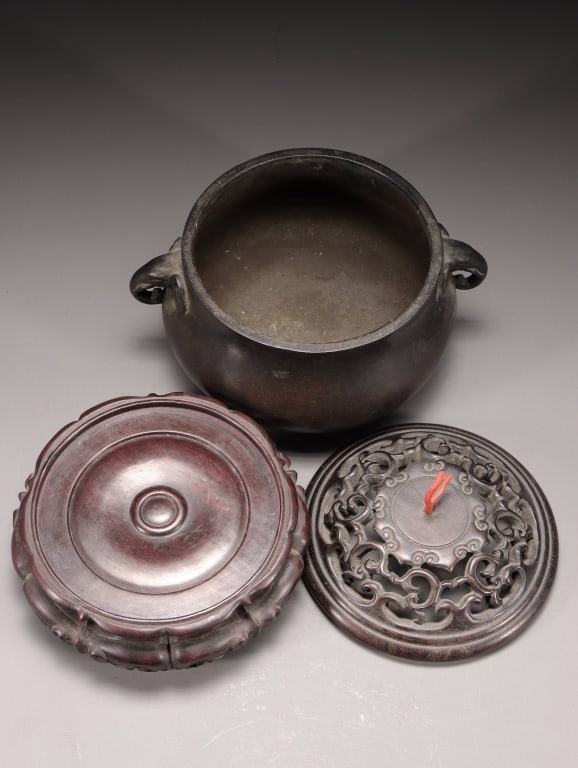 Chinese Bronze tripod Incense Burner: Chinese bronze tripod incense burner fitted with a carved zitan wood openwork lid, a branch coral finial, and a matching custom-carved hardwood display stand. Dimension: 18cm H x 15cm w,weight is 1668