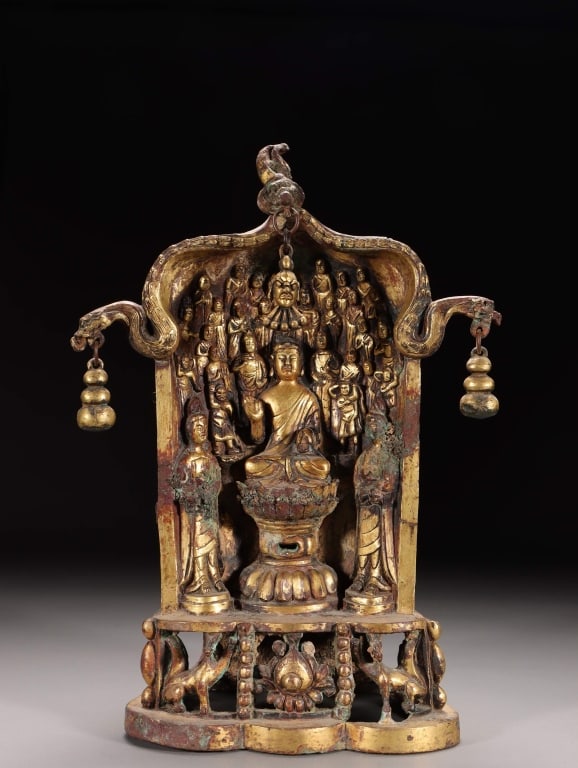Chinese gilt bronze Buddhist votive shrine: Dimension: 25cm H x 17.5cm x 9.5cm w,weight is 2322gram. The center features a seated Buddha elevated on a tall lotus pedestal, flanked by two standing Bodhisattvas on smaller lotus bases. Behind the