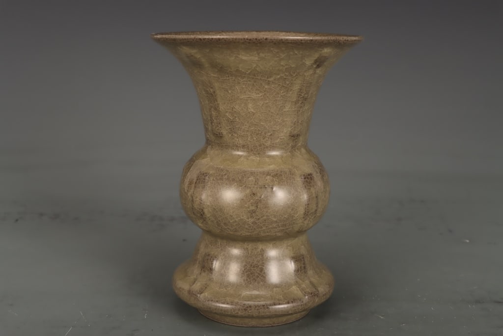 Chinese Guan Ceramic Vase: Dimension: 17cm H x 12.3cm W . The vase is coated in a thick, semi-glossy celadon glaze with an olive-brown tone. The surface is completely covered in a prominent, network of dark intersecting lines k