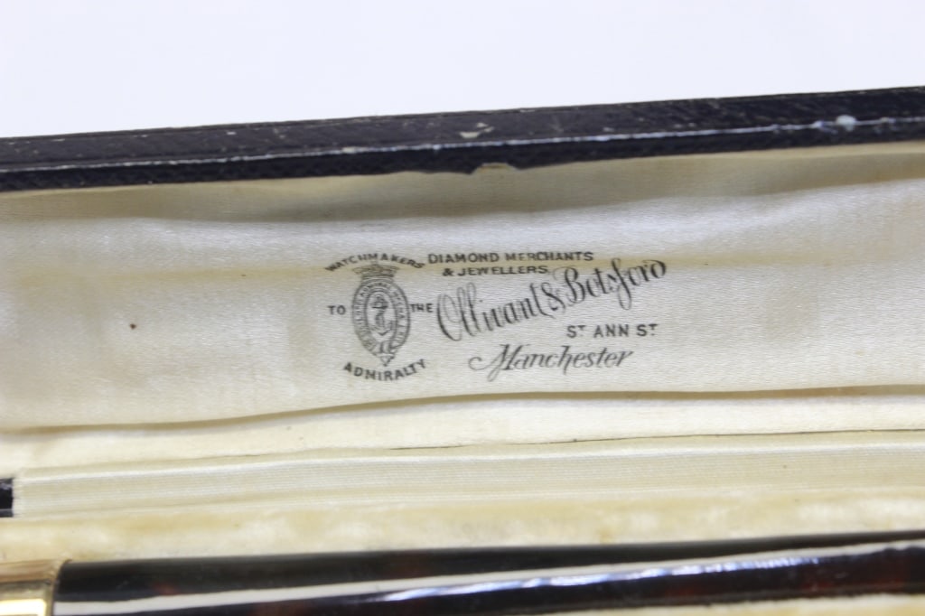 Antique Cigarette Holder: Top Center is the Mother-of-Pearl Cheroot Holder. Bottom Center is a thick, wide-bore chamber piece crafted from semi-opaque, swirling butterscotch amber. It has a beautiful, wide