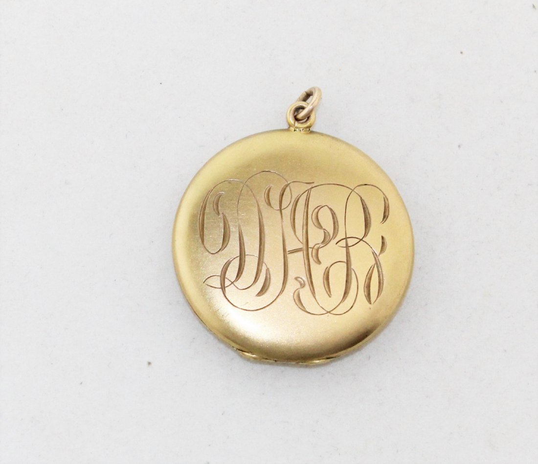 Antique Victorian Engraved Gold Fill Gilt Locket: Antique Victorian Engraved Gold Fill or Gilt Locket with original mom and pop photos included. The locket is 1 3/8" across and the bale adds to the height, so included with the locket, the height is 1