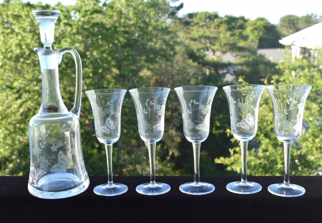 Toscany Romania Hand Blown Glass Wine Decanter Set: VTG Set Toscany Romania Hand Blown Glass Wine Decanter Long Stem Etched. DETAILS: Beautiful etched Butterfly and Flowers on each glass and on decanter. The set includes 5 long stem wine glasses and a 