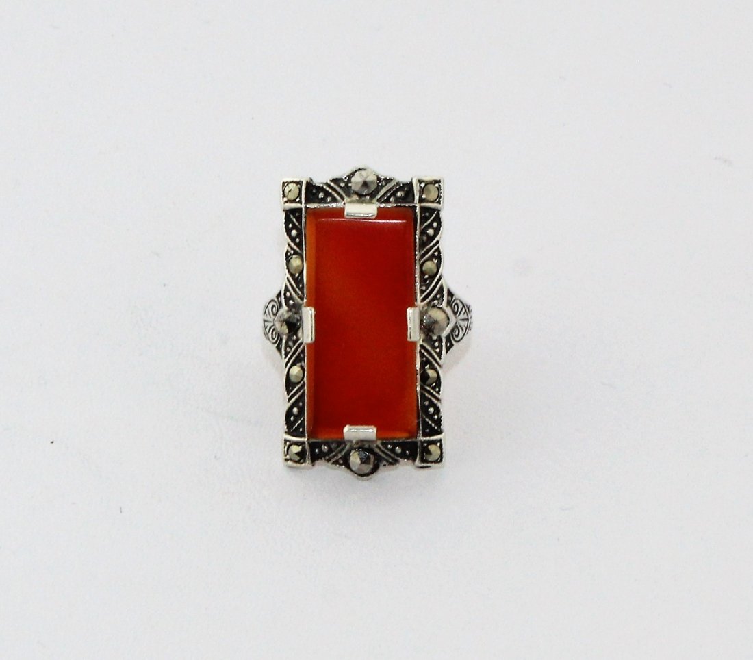1920's Art Deco Sterling Marcasite Carnelian Ring: This is a beautiful 1920's Art Deco Sterling Marcasite Carnelian Ring from a Shelby, NC estate. It is marked "Sterling U" with an arrow pointing at the U on either side. It fits size 6 1/2. The ring i