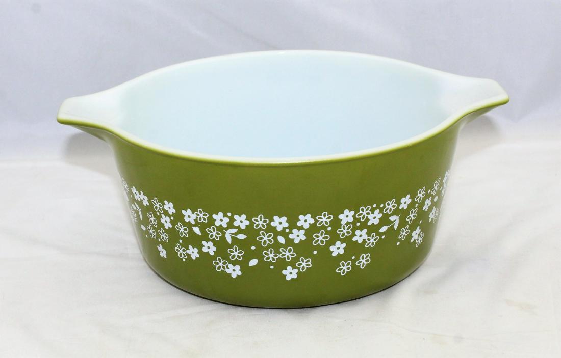 Avocado Green Flower Pyrex Casserole Dish: Avocado Green Flower Pyrex Large Casserole Dish that measures 9 1/4" by 7 1/2" across the top and 3 1/2" high.