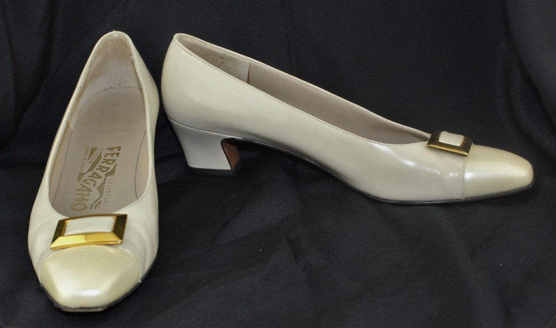 SALVATORE FERRAGAMO Ivory Leather Shoes Size 7.5 AA: SALVATORE FERRAGAMO Women's Ivory Leather Classic Pumps Shoes - Size 7 1/2 AA. Material: Leather. Measurements:Interior Length: 9 3/4" Interior Width: 2 3/4"Exterior Length: 10" Exterior Width: 2 7/8"