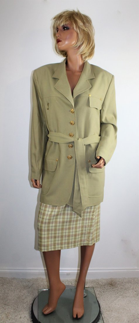 Louis Feraud (French 1920-1999) Skirt Suit Size 12: Beautiful Louis Feraud skirt suit with belted blazer in a size 12. The content is 75% wool, 15% Viscose, 10% Polyamid. The blazer is beige and the plaid skirt is light yellow, beige, red & orange. Mad