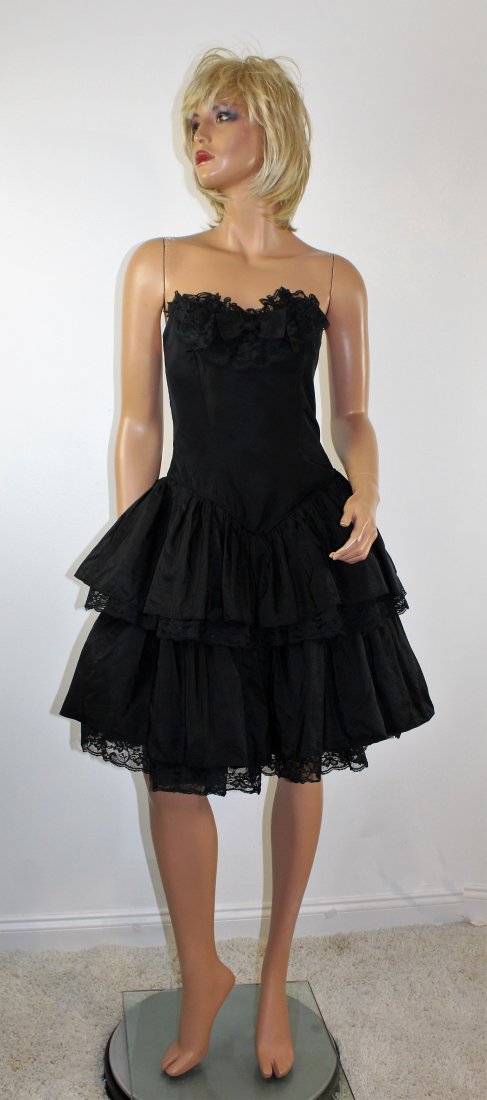 Vintage 80's Strapless Black Cocktail Dress Size XS: Vintage 80's Strapless Black Cocktail Dress, made in a 50's style with tiered layers and crinoline in between. The skirt measures 110" around at the hem. It is marked size 7/8, but fits like an Size X