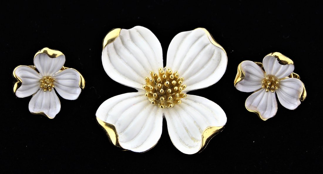 Crown Trifari Dogwood Flower Brooch & Earrings Set: Crown Trifari white enamel and gold gilt Dogwood Flower Brooch & clip on Earrings Set. The brooch is 1 7/8" wide and 1 7/8" high. The earrings are 3/4" by 3/4".