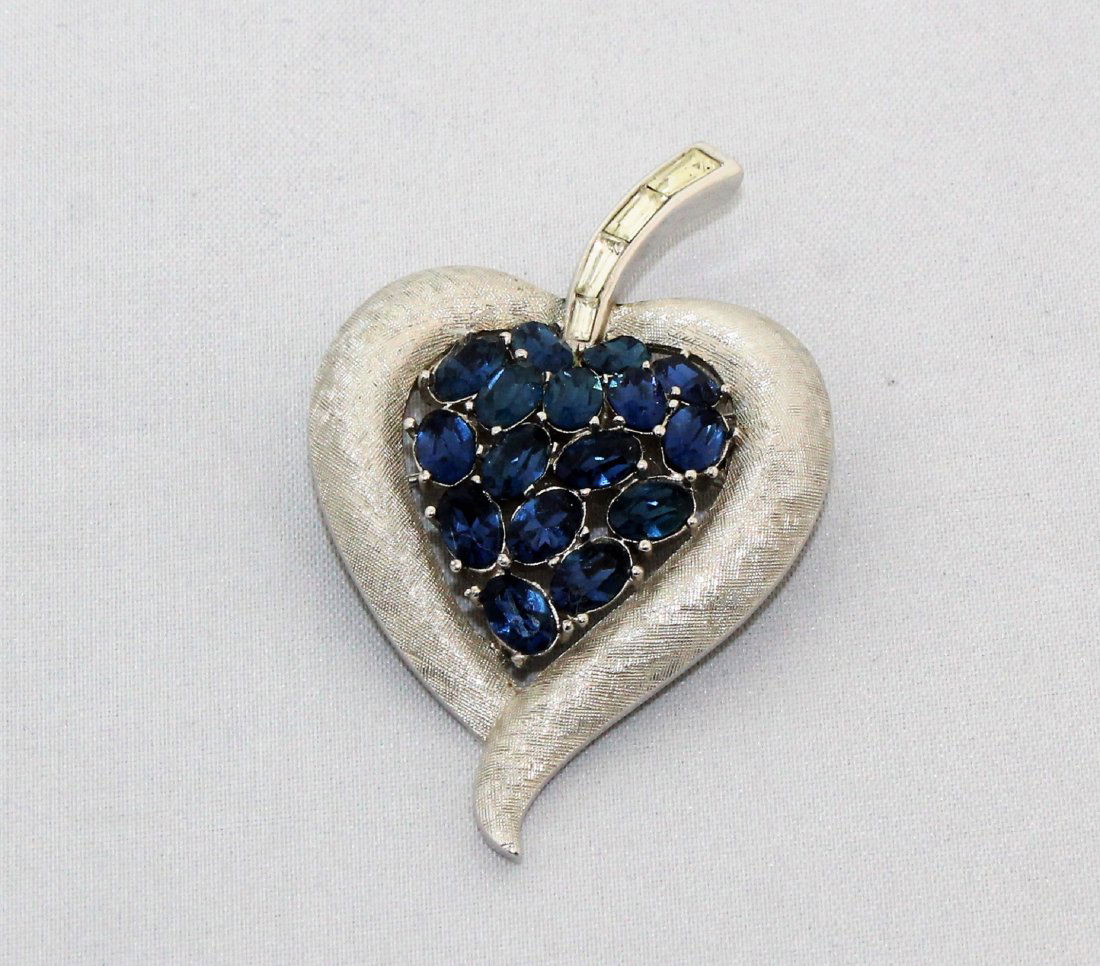 Crown Trifari Heart Blue Rhinestone Brooch Pin: Crown Trifari Heart Shaped Silver Tone Brooch with royal Blue and clear Rhinestone. 2 1/4" high, 1 3/4" wide.