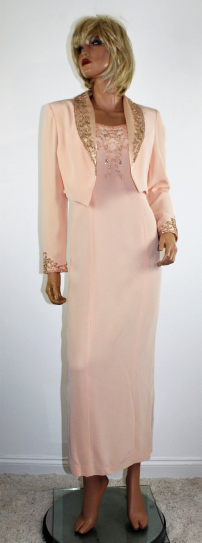Oleg Cassini Black Tie Beaded Formal Dress & Jacket - 4: Oleg Cassini Black Tie Beaded Light Orange Formal Dress & Jacket -in Size 4. The formal gown from shoulder to belly button in the front and around the armholes and neck. It is fully lined, in a slimmi