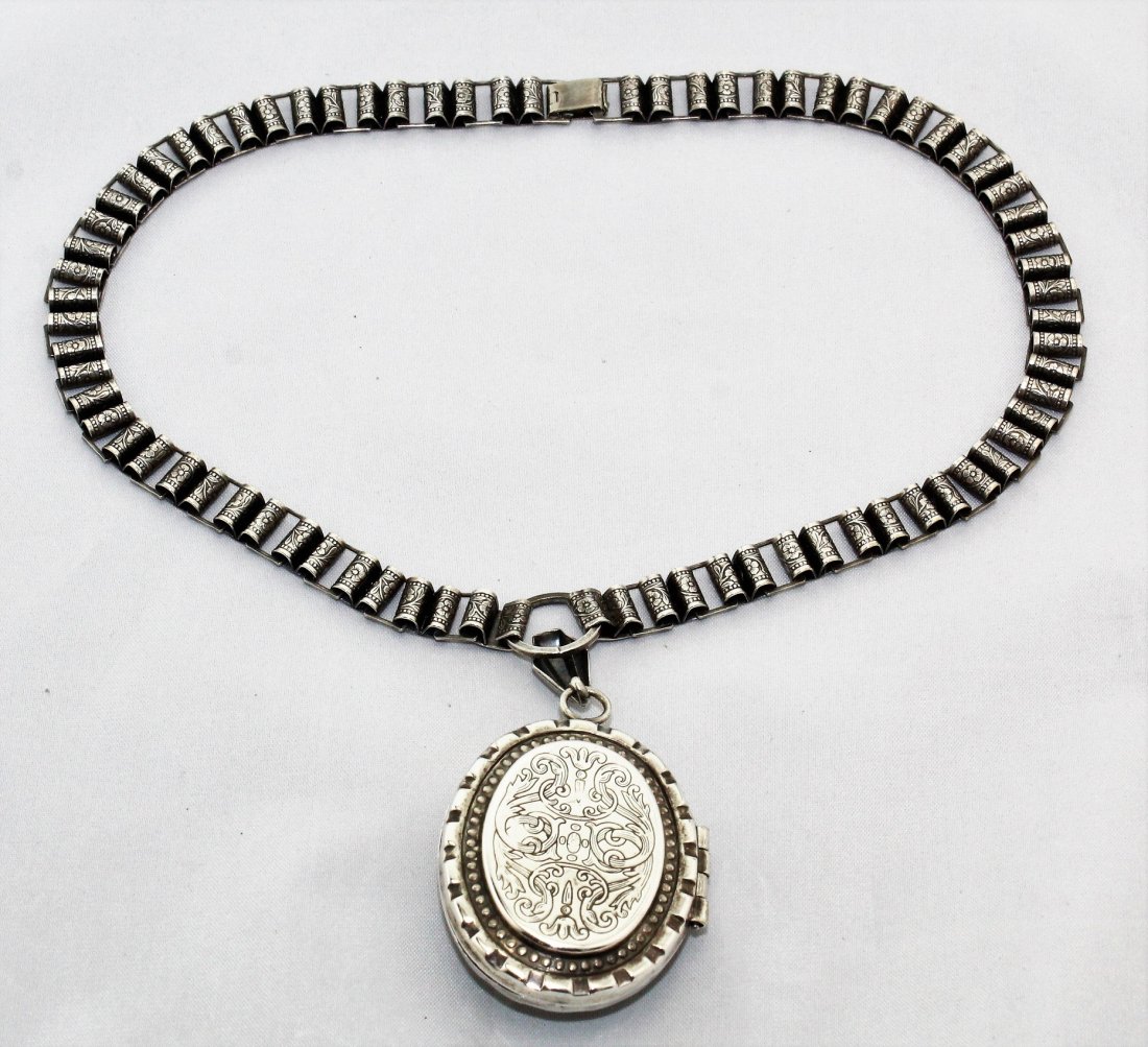 Antique Victorian Book Chain Necklace & Locket: This is a beautiful vintage/antique book chain necklace and ornate raised locket and is either Victorian or 50's Victorian Revival. It is silver tone metal. The chain is 18" long and 3/8" wide. The go