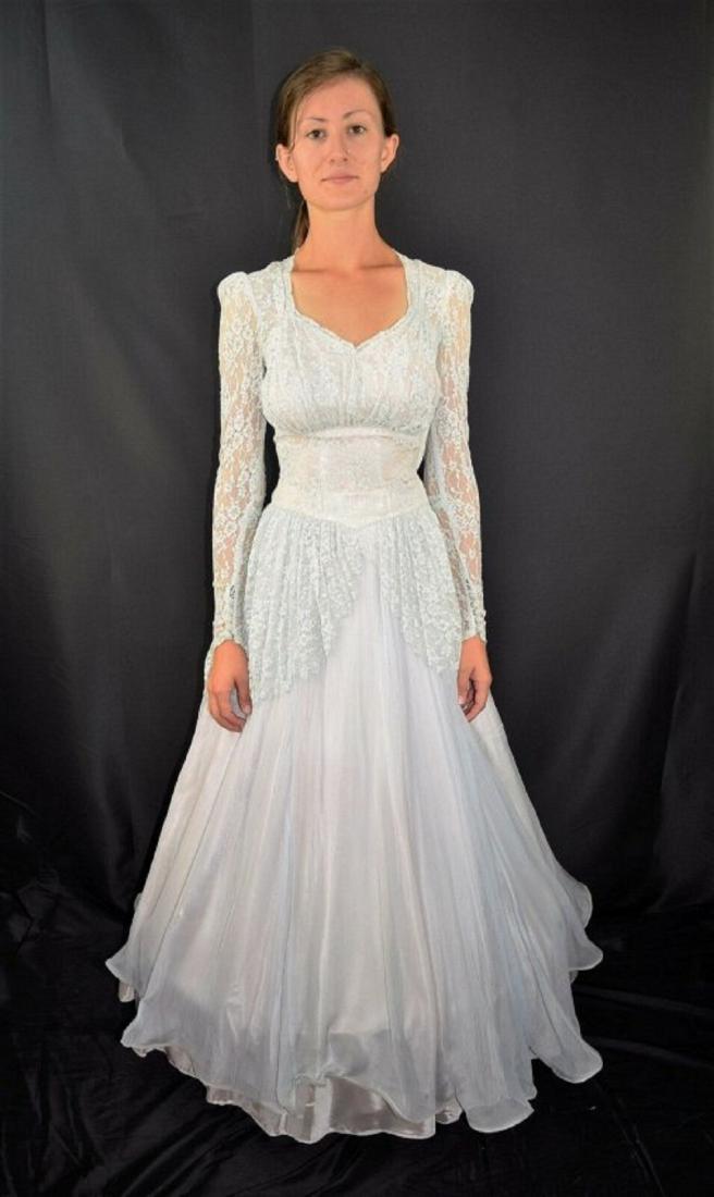 Vintage 50's Sheer Blue Lace Rockabilly Swing Dress: Vintage 50's Pin Up Sheer Light Blue Lace Rockabilly Swing Bubble Dress. Details: Fitted lace bodice, full pleated skirt that measures 166" around. Light pink lining. The sleeves come to a point and h