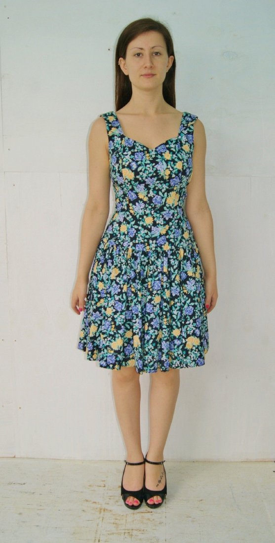 Vintage 80s Laura Ashley Gt Britain Flower Print Dress: Vintage 80's Flower Print Swing Dress Laura Ashley Gt Britain Size 8. Condition - no stains, no holes, no wear.Size: 8 Color: black background with purple, teal green, yellow & white flowers. Details: