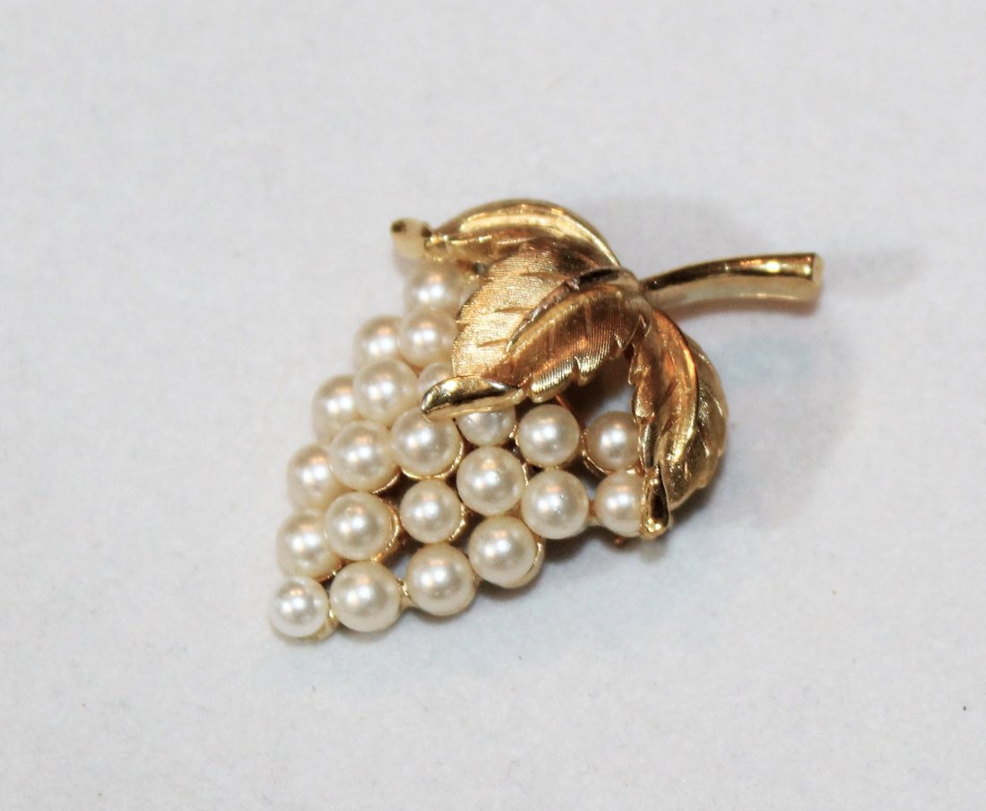 Crown Trifari Pearl Grape Cluster Pin Brooch: Crown Trifari Faux Pearl Grape Cluster Gold Plate Pin Brooch measures 1 5/8" high and 1 inch wide.