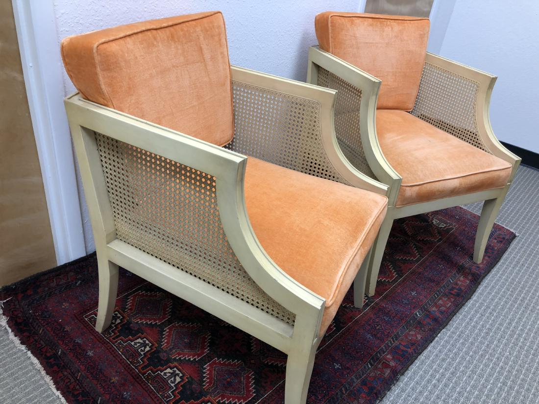 Pair of Mid Century modern chairs: Pair of mid century modern orange velvet and cain chairs in original creme paint. Chairs each measure approx 32" tall x 22w x 27" deep. Some paint nicks and some faded fabric.