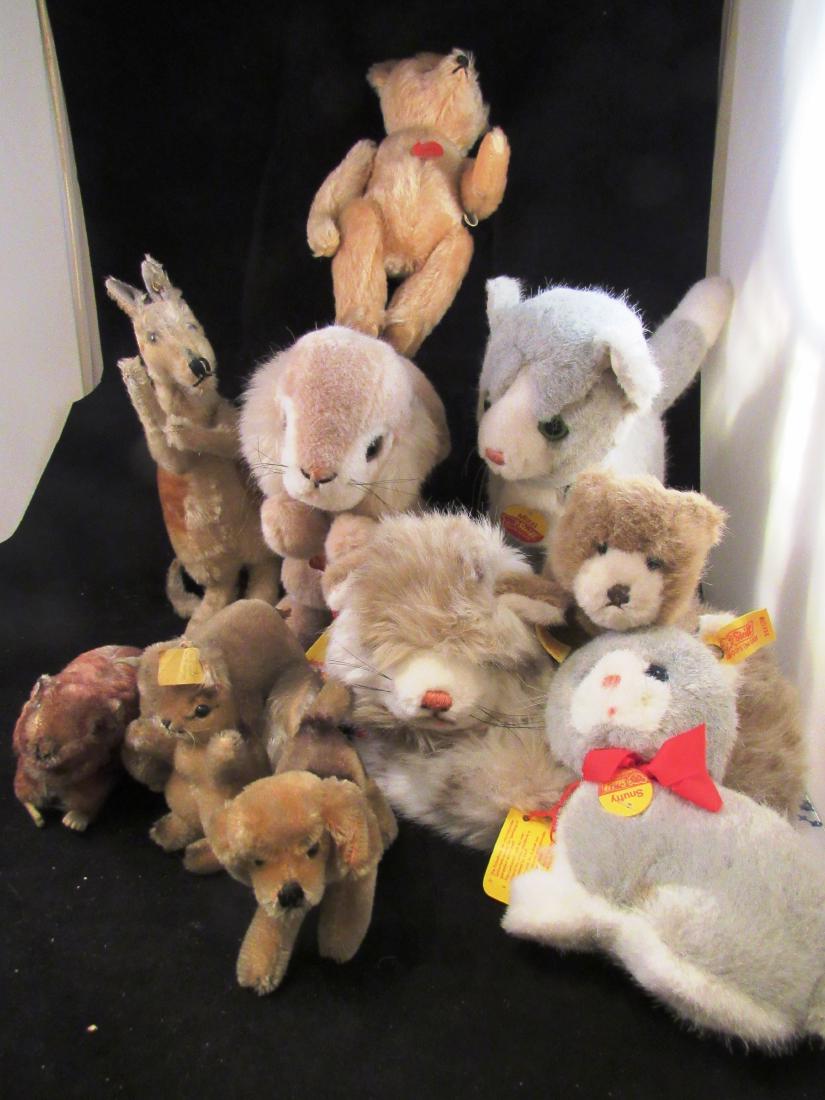 (9) antique & vintage Steiff animals plus: Lot includes a scarce 1950's 10 inch male kangaroo, (no pouch),with articulated arms, glass eyes and ear button. Other older Steiffs are: small Murmy woodchuck with ear button and paper tag, small rhi