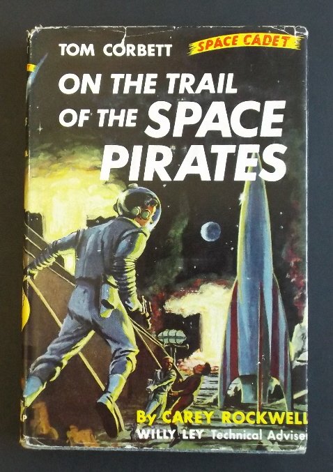 On the Trail of the Space Pirates Tom Corbett 1956: "On the Trail of the Space Pirates: A Tom Corbett Space Cadet Adventure", by Carey Rockwell, illustrated by Louis Glanzman, Willy Ley, technical adviser, published by Grosset & Dunlap, copyright 1953,