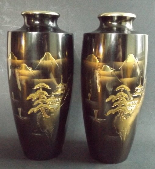 Pair of Japanese Damascene Steel Vases Gold Inlay: Pair of Japanese damascene and niello steel vases [gold inlay and black enamel on steel surface]. Mountain and Temple scene among bonsai gardens, and a few sail boats on water. Rates vary per country,