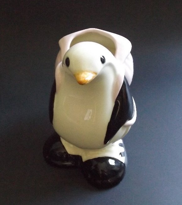 Penguin Figurine with backpack Art Pottery Vase 1979: Art pottery, penguin figurine with backpack - vase, fully glazed, the artwork is signed and dated [incised on bottom under glaze], "Martha Love, 9-21-79." Rates vary per zone/country, we will adjust s