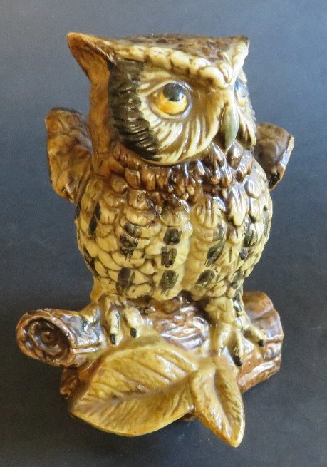 Owl on Logs Porcelain Figurine, Homco 1970s: Hand painted porcelain owl on log figurine, crossed swards porcelain mark of Homco, probably made in Japan, 1970s. The founder of Homco, Mary C. Crowley, worked in the insurance industry and the furni