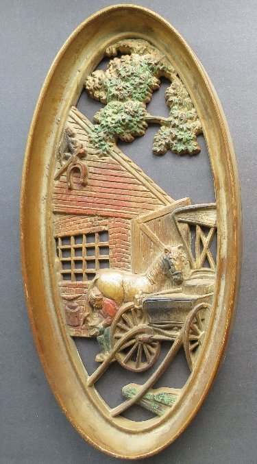 Smith Workshop, Oval Wall Plaque 1965 Mid Century Decor: Smith workshop and a farrier working on horseshoe, vintage oval wall plaque that looks like antique aged with patina hand colored wood curving [made out of hard plastic]. Marked "Burwood Products Co.