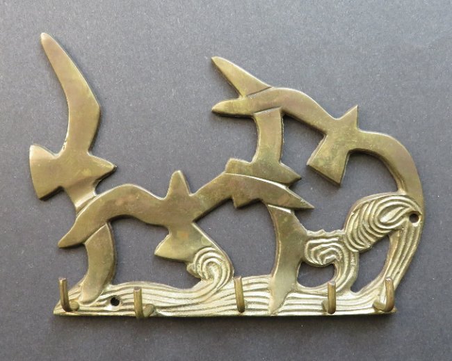 Seagulls over the Stormy Sea brass wall plaque hanger: Seagulls over the Stormy Sea, a hand cast solid brass wall plaque with five hooks to use as a hanger, unmarked, artist unknown, c. 1960s-80s US: Priority (c.2-4 days) ------- $14.50 Canada: Priority (