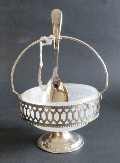 Gales of Sheffield England condiment sugar bowl 1960-70: Condiment or sugar bowl by Gales of Sheffield, England, a frosted / opal glass bowl with silver plated footed stand with rim, handle and spoon holder. The original serving spoon is present. The glass
