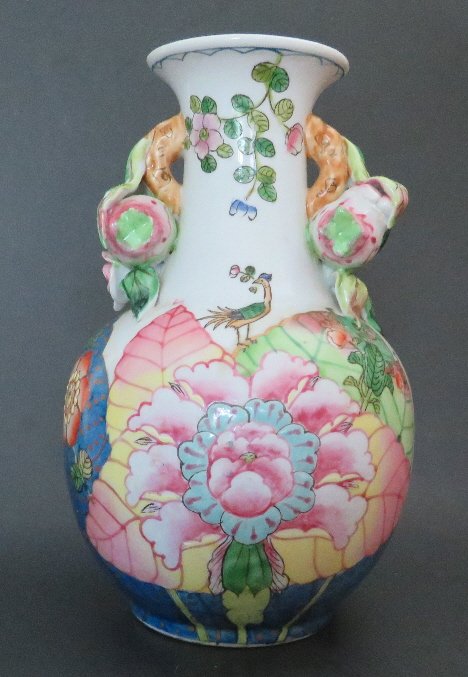 Chinese Tobacco Leaf Pattern Porcelain Vase 1950s: Chinese vase decorated in the Tobacco Leaf pattern with gilt highlights, the trumpet neck with bright floral sprigs and flanked by fruiting pomegranate branch handles; Andrea By Sadek paper label on t