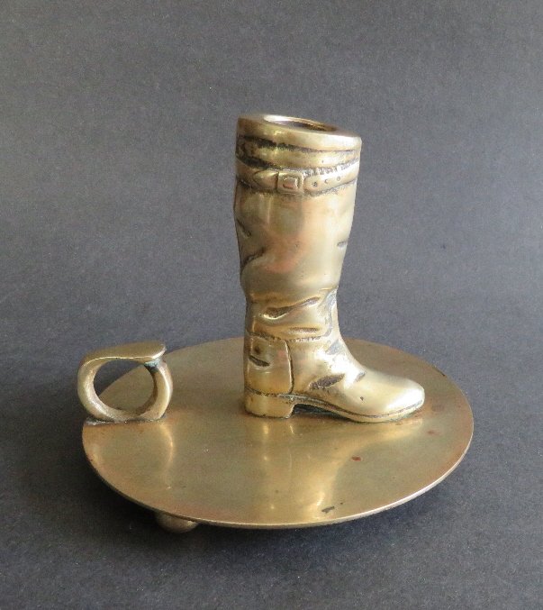 Ralph Lauren Riding Boot Candle Holder, 1970s: Equestrian riding boot solid brass candle holder designed by Ralph Lauren, New York, early 1970s, made in South Korea. Ralph Lauren Corporation is an American company headquartered in New York City, f