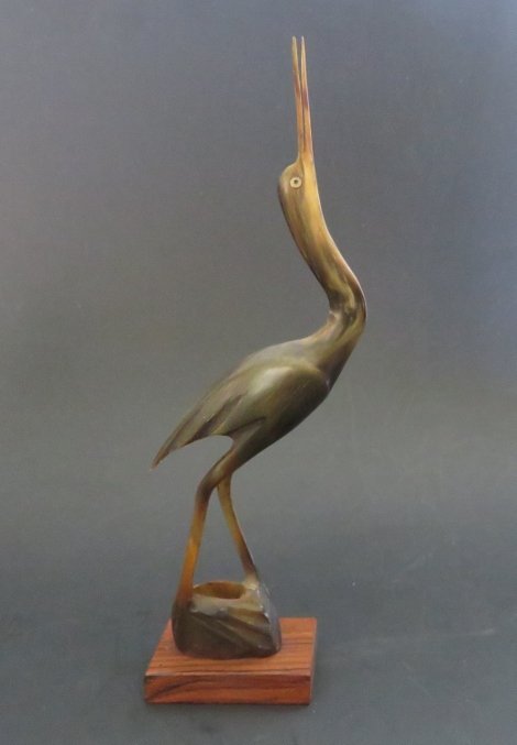 Vintage Crane Figurine, Hand Carved Horn, 1950s India: Vintage fine Crane sculpture, hand carved horn on wooden base, there is a vintage label and additional white stamp "India" on the bottom, c.1940s-1960s. The crane is 8.3/4" [22.2cm] tall with the base