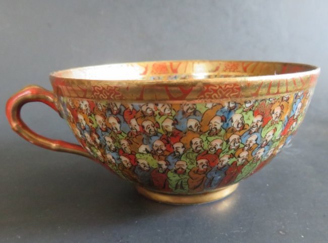 Antique Japanese Hand Painted Porcelain Handled Tea Cup, 1000 Scholars: Antique hand painted porcelain Japanese handled tea cup, "Thousand Scholars" or "Thousand Faces" theme, note that each miniature face inside and outside of cup [c.1/8" / 4mm] is finely painted and has