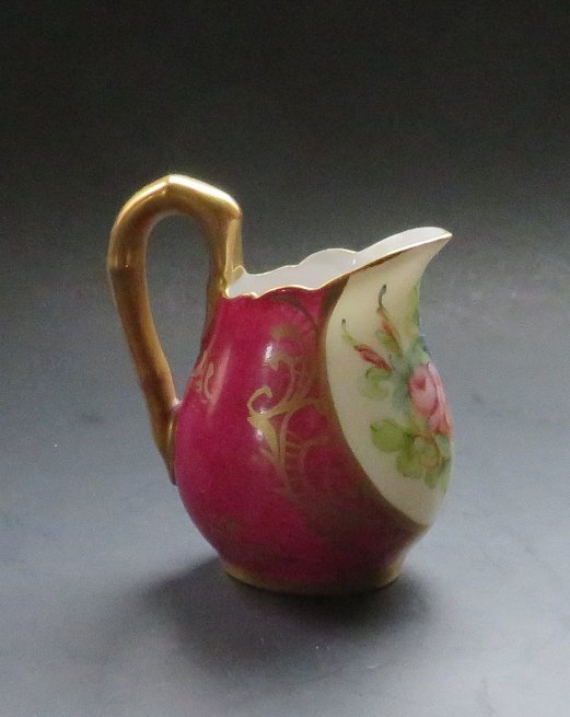 Antique French Art Nouveau Porcelain Creamer Meissna Limoges 1890s: Antique Art Nouveau fine translucent porcelain small creamer, decorated with dark red and gold, hand painted decorations and flowers, marked with handwriting in gold "E.G. decor meissna" and stamped L