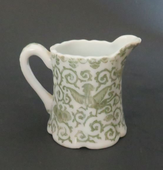 Antique Meiji Era Dai Nippon Porcelain Creamer, Phonix, Japan 1880s: Antique Japanese porcelain creamer with traditional Phoenix design, late 19th century, Meiji Era (1868-1912). The maker's mark contains Dai Nippon [Great Japan] characters. It is generally accepted th