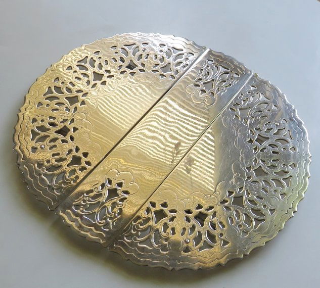 Vintage Art Deco Filigree Pearced Silver Plated Expandable Trivet, Italy 1940s: Vintage expandable pierced filigree trivet, with a small hallmark "Quality Silverplated, Italy" with "WA" vignette in the middle, a William Adams export to the United States, mid 20th century [1940s-1