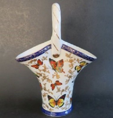 Porcelain Basket Vase Formalities Butterfly Collection Baum Brothers 1980s: Vintage porcelain vase in shape of a handled basket, golden floral decorations, multi-colored butterflies on ivory-white glaze. Gold trim around rims and is striped along handle, gold mark on the bott
