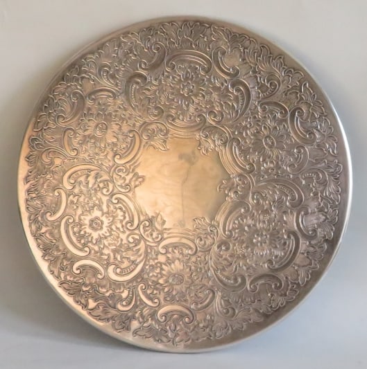 Vintage English Trivet, Wine Coaster, Silverplate on Nickel Silver, 1930s-1960s: Vintage embossed trivet, wine coaster, marked on the edge "EP-NS / Made in England" [electroplated on nickel silver], 1930s-1960s. The trivet is c.7.1/8" [18cm] across, some kind of padding and green