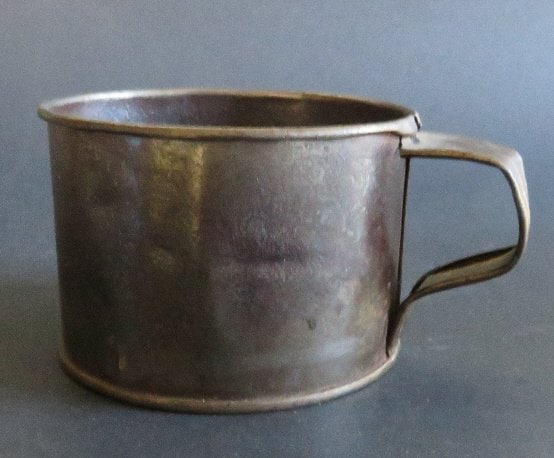 Antique American Tin Cup, Middle-Late 1800s: Antique American tin cup, c. middle-late 1800s. The cup is 2.1/2” tall and 3.1/2” [5.4cm x 8.9cm] across; aging, patina, very good condition. Rates vary per zone/ country, we will adjust s