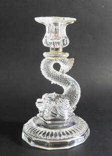 French Vallerysthal Portieux Crystal Glass Candle Holder, Heraldic Dolphin: Antique Vallerysthal Portieux crystal glass candle holders in the shape of heraldic dolphin on round bases, an 8-sided top, unmarked, Lorraine, France. This French Baroque design was introduced by Val