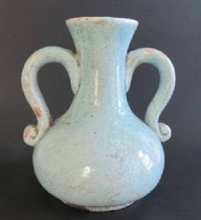 Vintage Chinese Celadon Glaze Pottery Vase, 20th Century: Fine quality primitive ancient-looking vase with a beautifully crackled stained celadon glaze, unmarked. Despite the antique look it is probably a vintage 20th century decor item. The vase is 7" [17.8