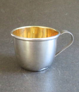 Sterling Silver Baby Cup, WEB 510: The sterling silver baby cup by Web Silver Company, Philadelphia. Classic cup with rolled lip and tapered curved handle. Gold washed interior, 1950s. Not monogrammed. Marked on bottom "STERLING WEB