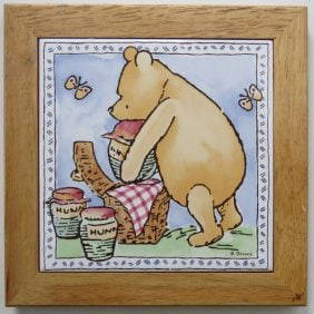 Disney, Winnie the Pooh Ceramic Tile, Selandia Designs, CA, Taiwan 1980s: Vintage Disney Winnie the Pooh Classic "Picnic Basket" ceramic tile framed in wooden frame, copyright by Disney; created by "Selandia Designs, Santa Clara, CA; made in Taiwan; original paper label on