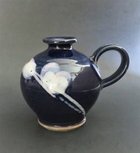 Vintage Blue Ceramic Vase with Handle, John Bauman Pottery 1980s: Vintage Mid Century Modern ceramic vase with handle, dark blue glaze with abstract rose / majolica mixed, partially heart shaped 'clouds' around, John Baum stoneware, signed on the bottom, 1980s. The