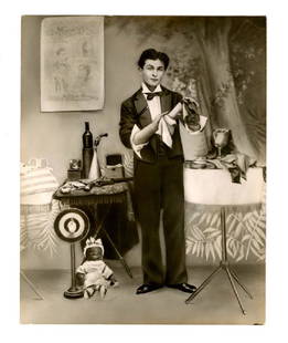 Terrific & early original publicity photo of magician: A publicity photograph of Harry Houdini, taken early in his career, soon before his discovery by Martin Beck Photograph, 8" x 10", black and white image of Houdini, posing full length in a tuxedo