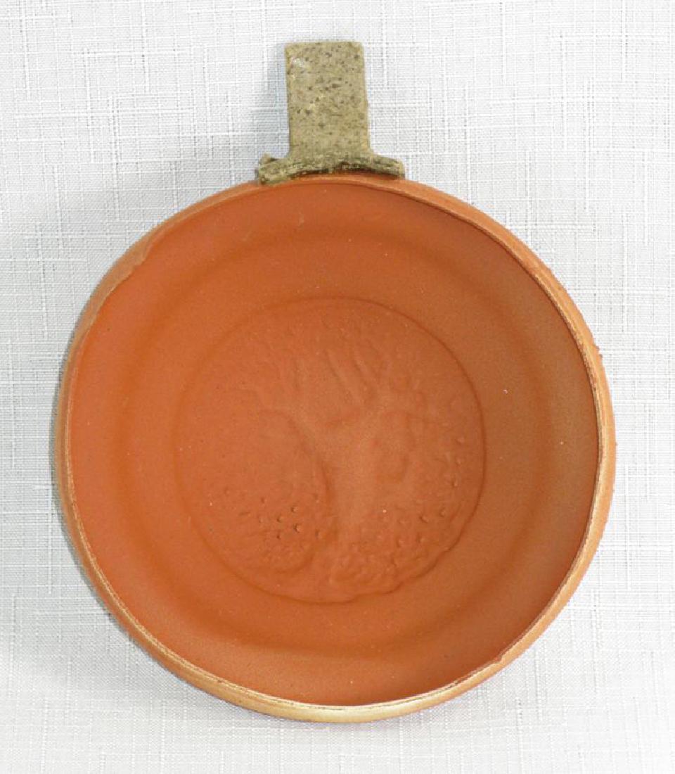 Annie, Get Your Gun! A clay pigeon owned by Annie: Oakley, Annie (1860-1926) Annie, Get Your Gun! A Clay Pigeon owned by Annie Oakley with impeccable provenance Ligowsky patent clay pigeon with its paper or pasteboard throwing tab. Clay pigeon 4.25" d