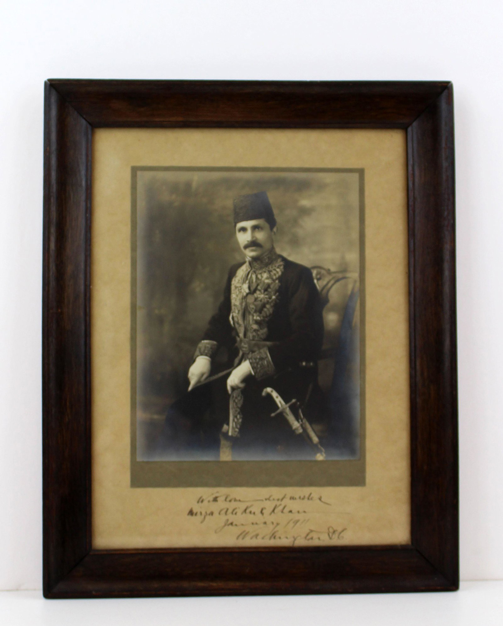 Ali Kuli Khan Beautiful Photograph Decked out in: Ali Kuli Khan Beautiful Photograph Decked out in Persian Regalia A black and white photograph, measuring 6.75" x 8.875", Washington, D.C., dated January 1911. Boldly signed on the mat, "With lov