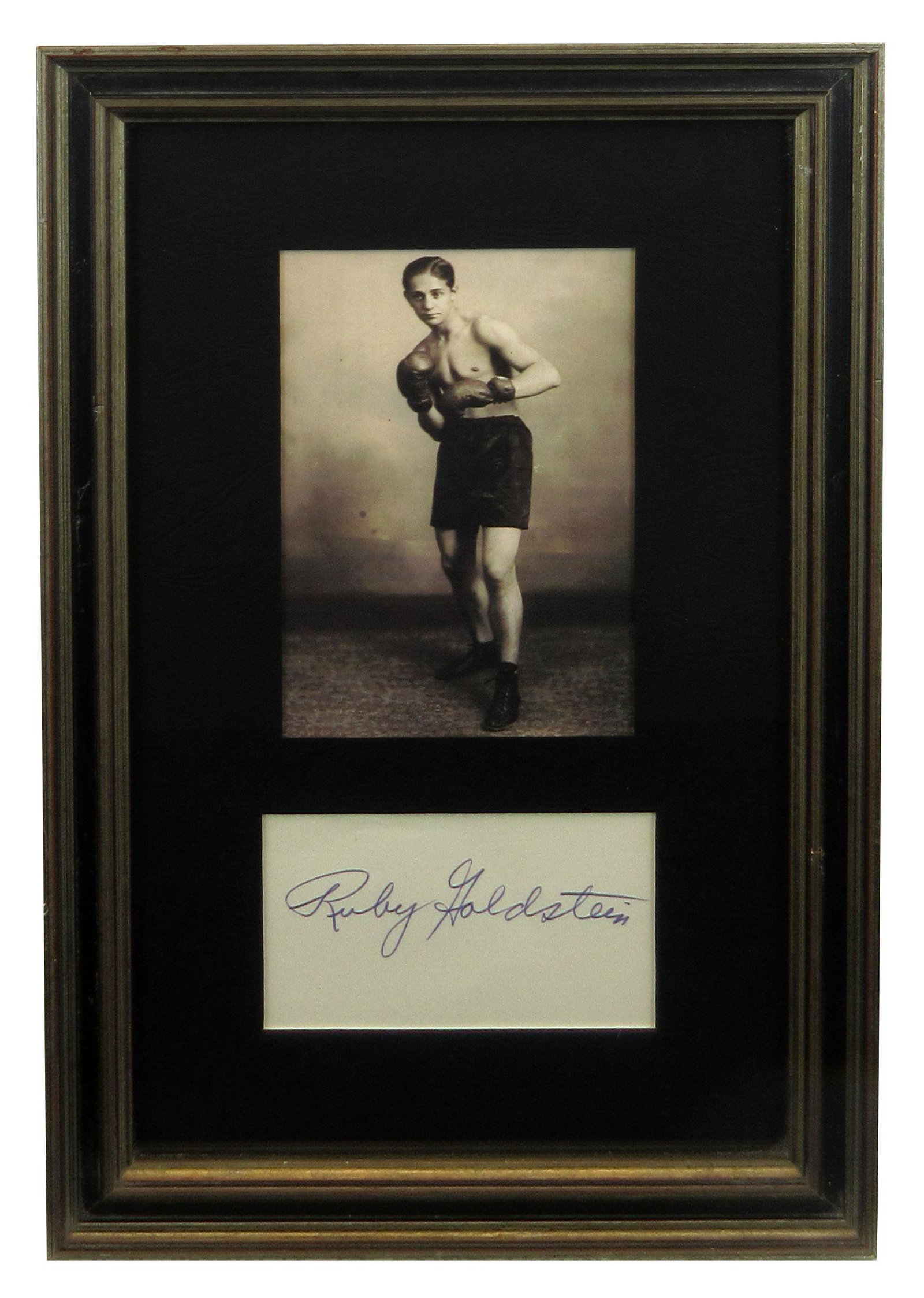 Ruby Goldstein Signature Handsomely Presented: Ruby Goldstein Signature Handsomely Presented An index card signed by professional championship boxer Reuven "Ruby" Goldstein (1907-1984) as "Ruby Goldstein." Displayed below a full-length sepia-color