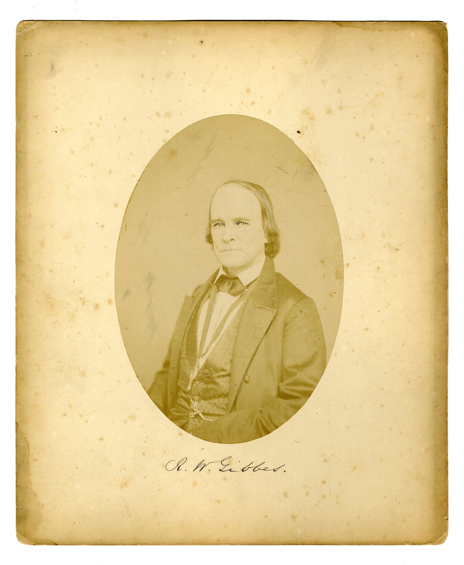 Robert W. Gibbes, Naturalist & Surgeon General of S.C.,: Robert W. Gibbes, Naturalist & Surgeon General of S.C., Signed Photograph Measuring 9.5" x 11.5", No place, undated [Ca. 1850s]. A salt print portrait of Robert Wilson Gibbes who is seen seated in