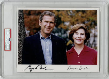 George W. Bush and Laura Bush Signed Photo. PSA Encapsulated.: George W. Bush and Laura Bush Signed Photo. PSA Encapsulated. Spectacular 8" x 10" glossy color photograph of 43rd U.S. President George W. Bush and First Lady Laura Bush, boldly signed as