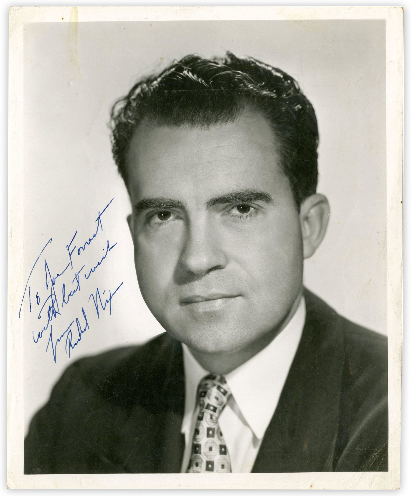 Richard Nixon Signed & Inscribed Publicity Photo: Richard Nixon Signed & Inscribed Publicity Photo Signed photo, measuring 8" x 10", n.p., undated. A glossy, black and white portrait photograph of a young Richard Nixon, inscribed in blue ballpoin